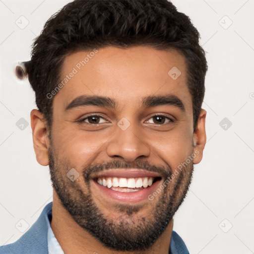 Joyful white young-adult male with short  black hair and brown eyes