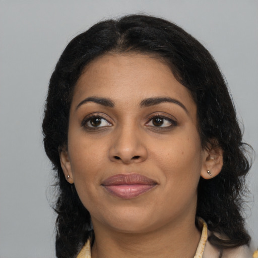 Joyful latino young-adult female with medium  black hair and brown eyes