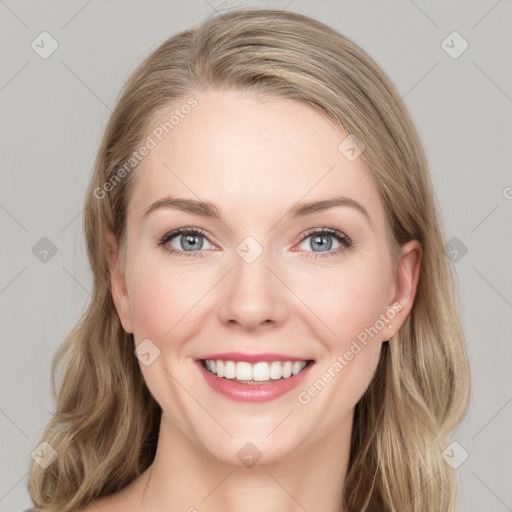 Joyful white young-adult female with long  brown hair and blue eyes