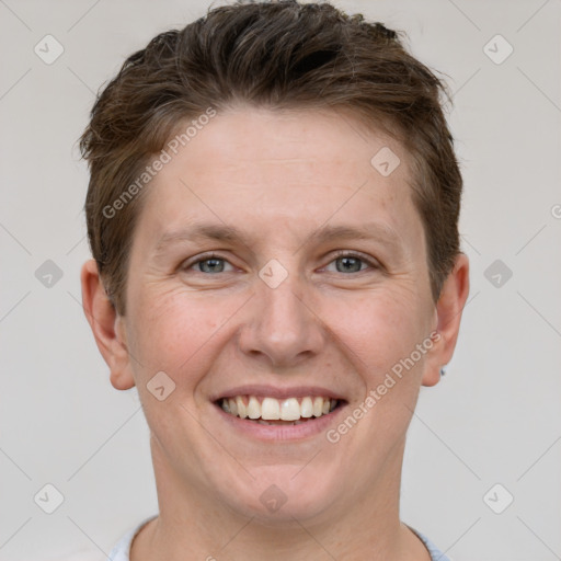 Joyful white adult female with short  brown hair and grey eyes