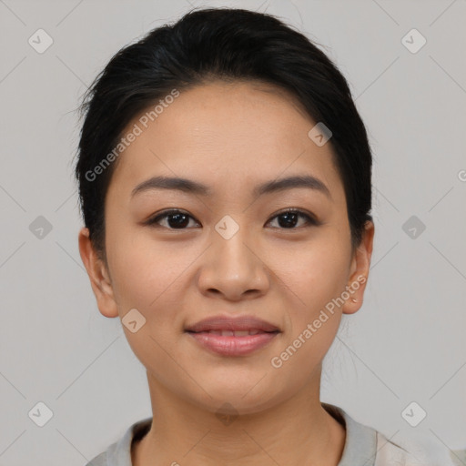 Joyful asian young-adult female with short  black hair and brown eyes