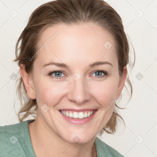 Joyful white young-adult female with medium  brown hair and blue eyes