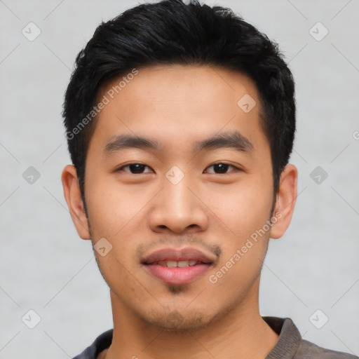 Joyful asian young-adult male with short  black hair and brown eyes