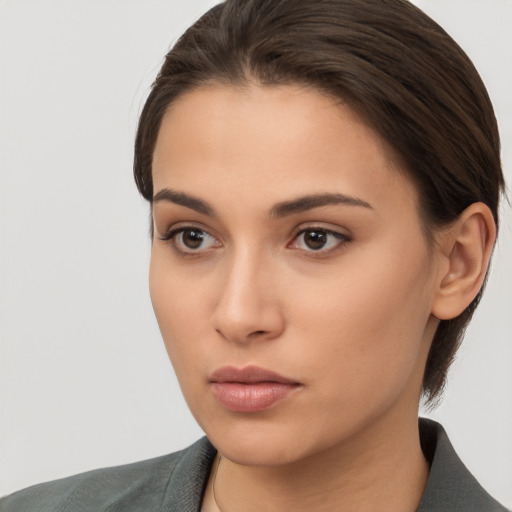 Neutral white young-adult female with long  brown hair and brown eyes