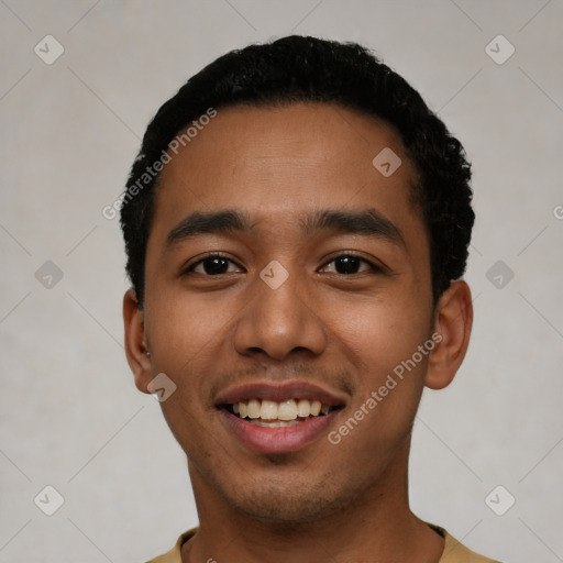 Joyful latino young-adult male with short  black hair and brown eyes