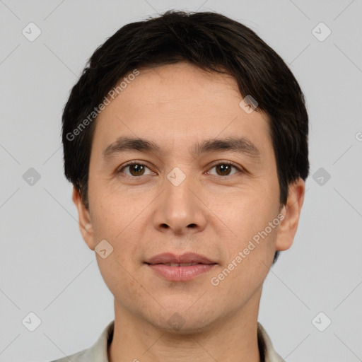 Joyful white young-adult male with short  black hair and brown eyes