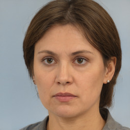 Neutral white adult female with medium  brown hair and brown eyes