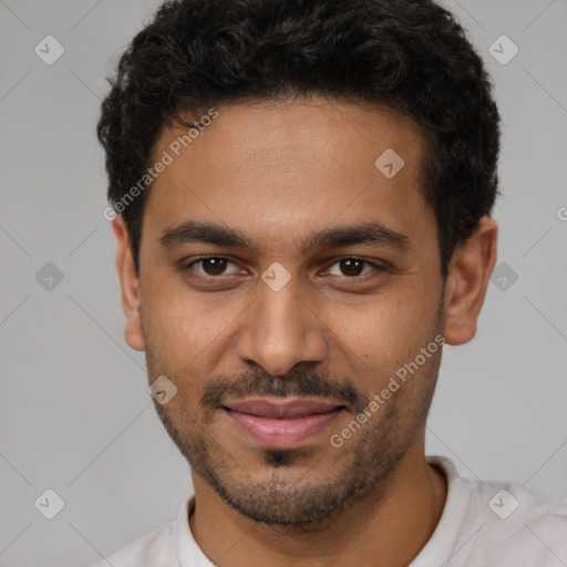 Joyful latino young-adult male with short  brown hair and brown eyes