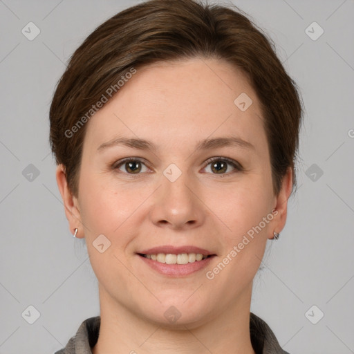 Joyful white young-adult female with short  brown hair and grey eyes