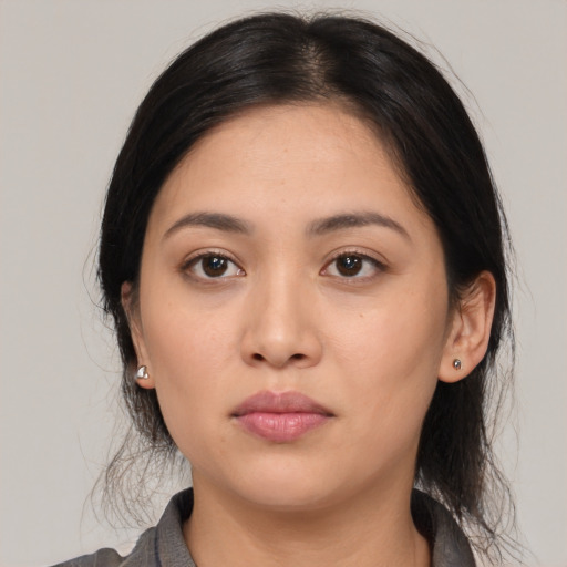 Neutral white young-adult female with medium  black hair and brown eyes
