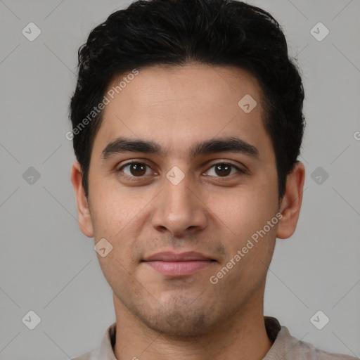 Joyful white young-adult male with short  black hair and brown eyes