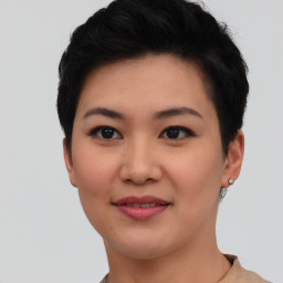 Joyful asian young-adult female with short  black hair and brown eyes