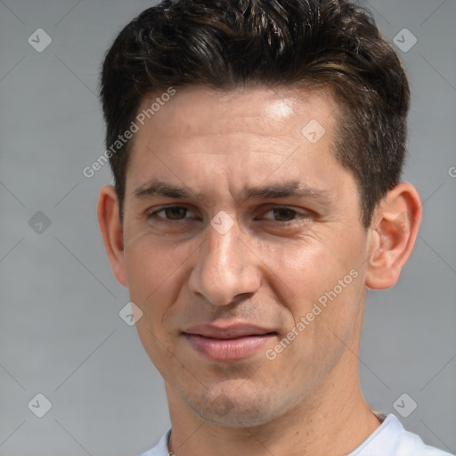 Joyful white adult male with short  brown hair and brown eyes