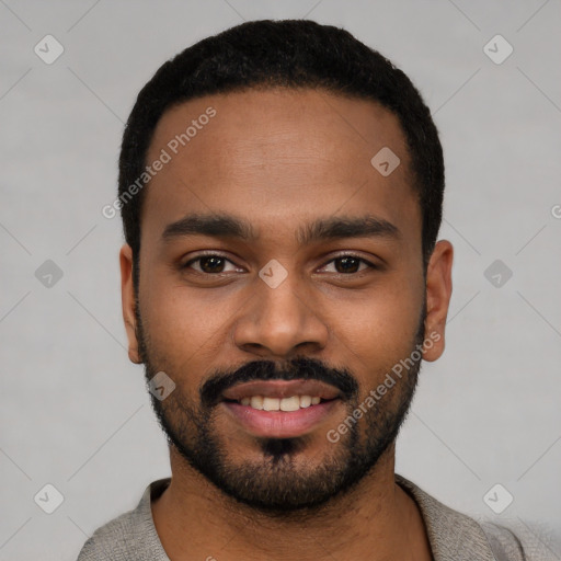 Joyful black young-adult male with short  black hair and brown eyes