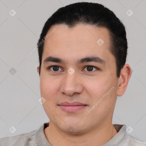 Joyful latino young-adult male with short  black hair and brown eyes