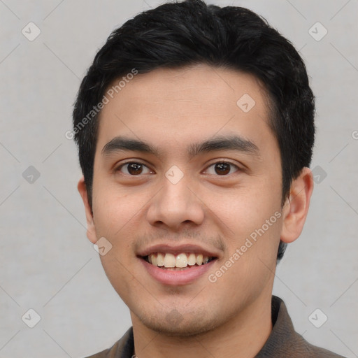 Joyful latino young-adult male with short  black hair and brown eyes