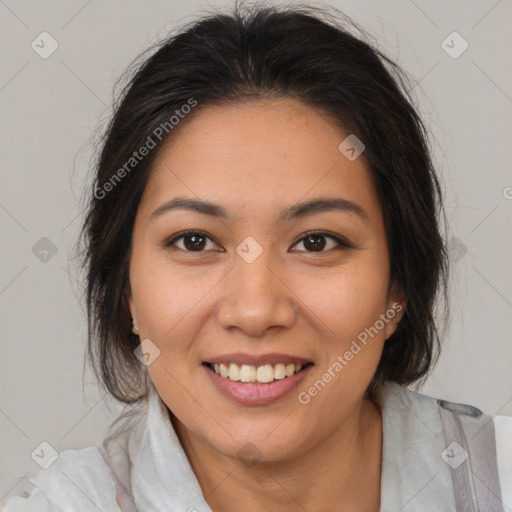 Joyful latino young-adult female with medium  brown hair and brown eyes