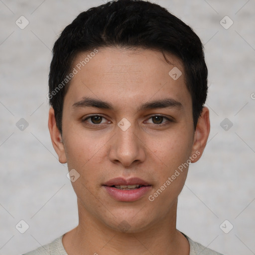 Joyful white young-adult male with short  black hair and brown eyes