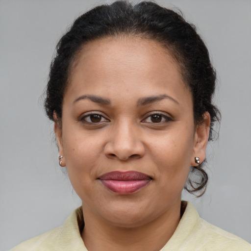Joyful latino young-adult female with medium  brown hair and brown eyes