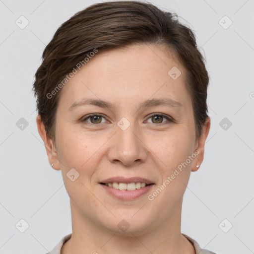 Joyful white young-adult female with short  brown hair and grey eyes