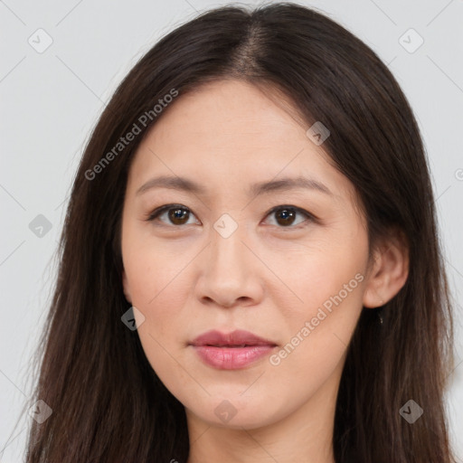 Joyful asian young-adult female with long  brown hair and brown eyes