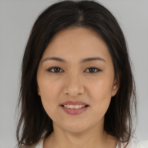 Joyful asian young-adult female with medium  brown hair and brown eyes