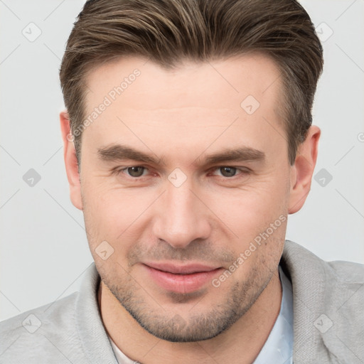 Joyful white young-adult male with short  brown hair and brown eyes