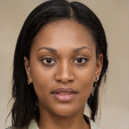 Joyful black young-adult female with long  brown hair and brown eyes