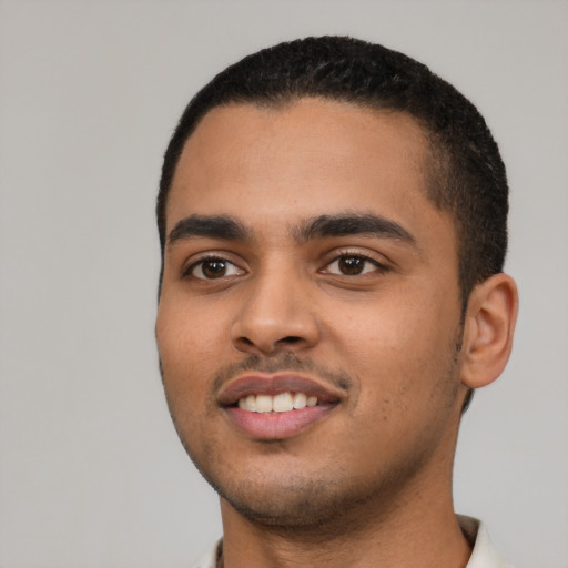 Joyful latino young-adult male with short  black hair and brown eyes