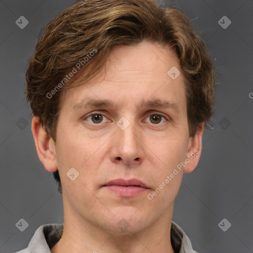 Joyful white adult male with short  brown hair and grey eyes