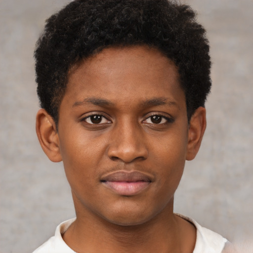 Joyful black young-adult male with short  brown hair and brown eyes