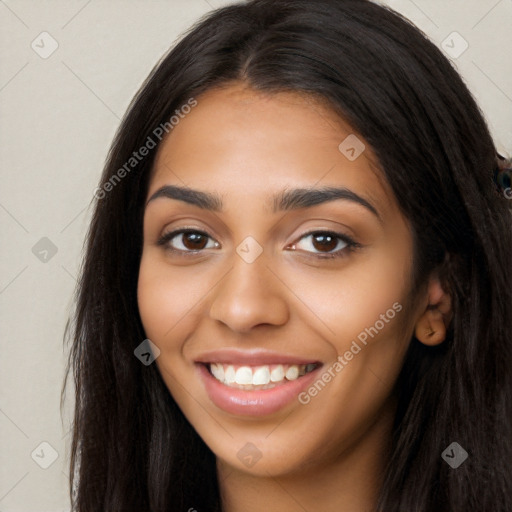 Joyful latino young-adult female with long  brown hair and brown eyes