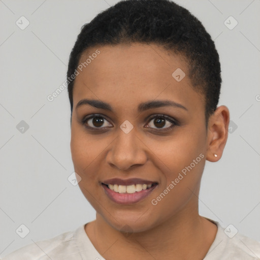 Joyful black young-adult female with short  black hair and brown eyes