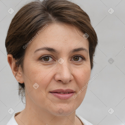 Joyful white adult female with short  brown hair and brown eyes