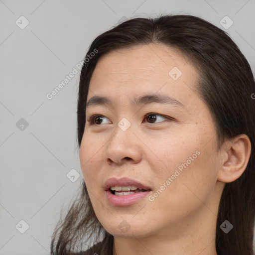 Joyful white young-adult female with medium  brown hair and brown eyes