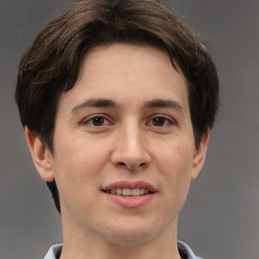 Joyful white adult male with short  brown hair and grey eyes