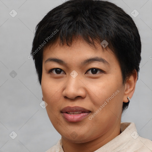 Joyful asian young-adult female with short  brown hair and brown eyes