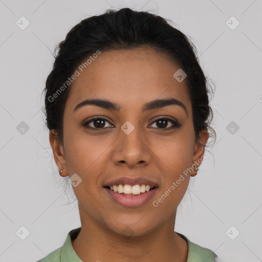 Joyful latino young-adult female with short  brown hair and brown eyes