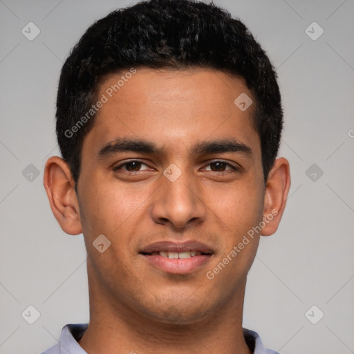 Joyful latino young-adult male with short  brown hair and brown eyes