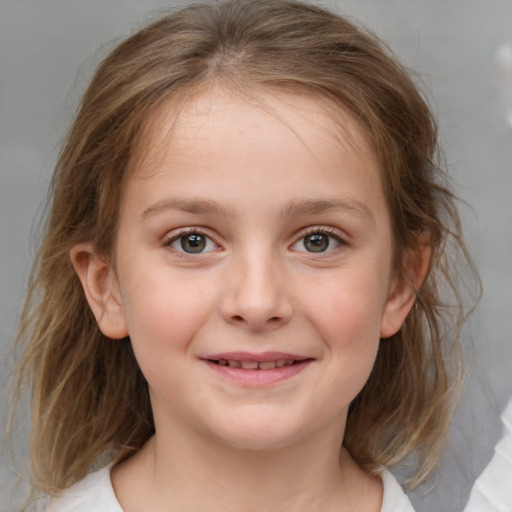 Joyful white child female with medium  brown hair and blue eyes