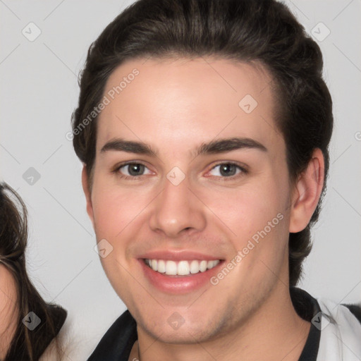 Joyful white young-adult male with medium  brown hair and brown eyes