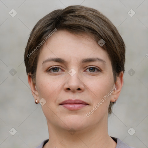 Joyful white young-adult female with short  brown hair and grey eyes