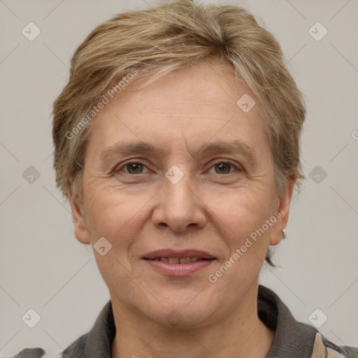 Joyful white adult female with short  brown hair and grey eyes