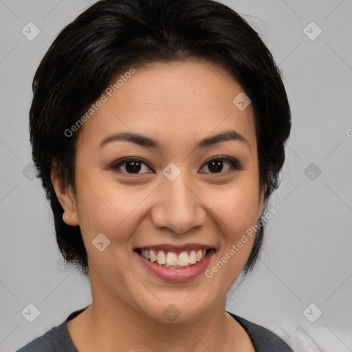 Joyful latino young-adult female with medium  black hair and brown eyes