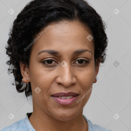 Joyful latino adult female with short  brown hair and brown eyes