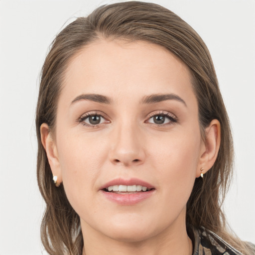 Joyful white young-adult female with long  brown hair and grey eyes