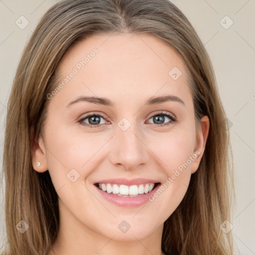 Joyful white young-adult female with long  brown hair and green eyes