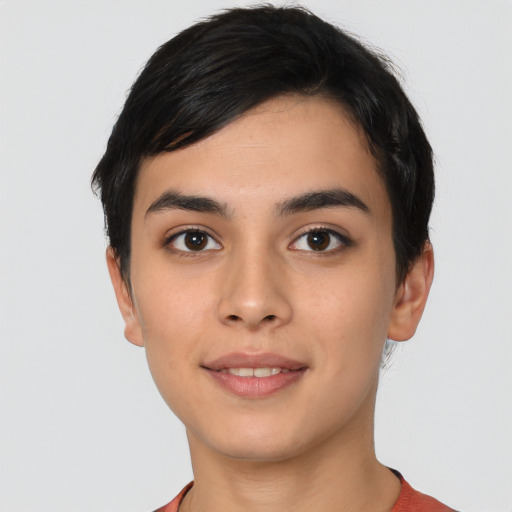 Joyful latino young-adult female with short  black hair and brown eyes