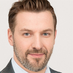 Joyful white adult male with short  brown hair and grey eyes