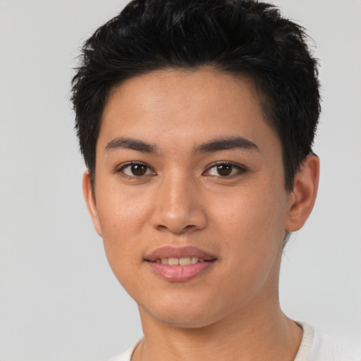 Joyful asian young-adult female with short  black hair and brown eyes